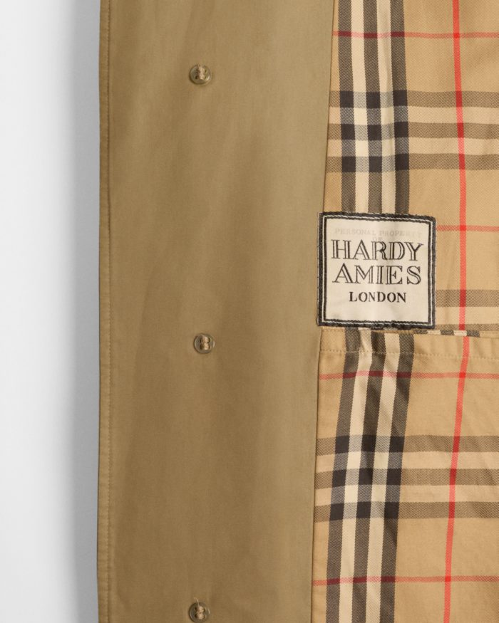 Detail of the personalised label in British fashion designer Hardy Amies’s Burberry car coat_ 1979