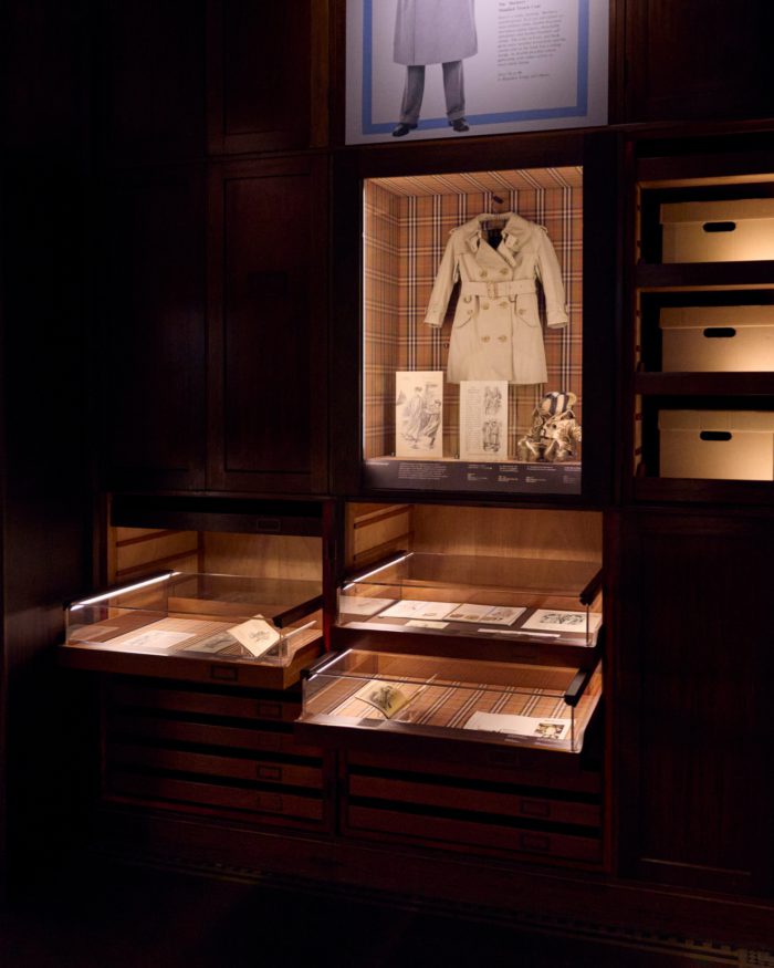The display features a children’s trench coat from 1970